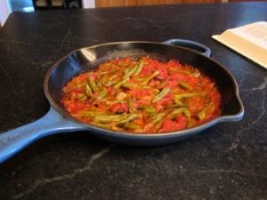 green beans and tomatoes in a skillet